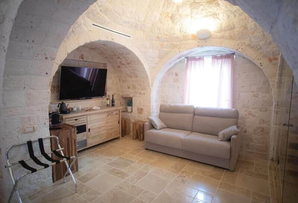 Luxury Suite, Sauna | Living area | 22-inch flat-screen TV with digital channels, TV