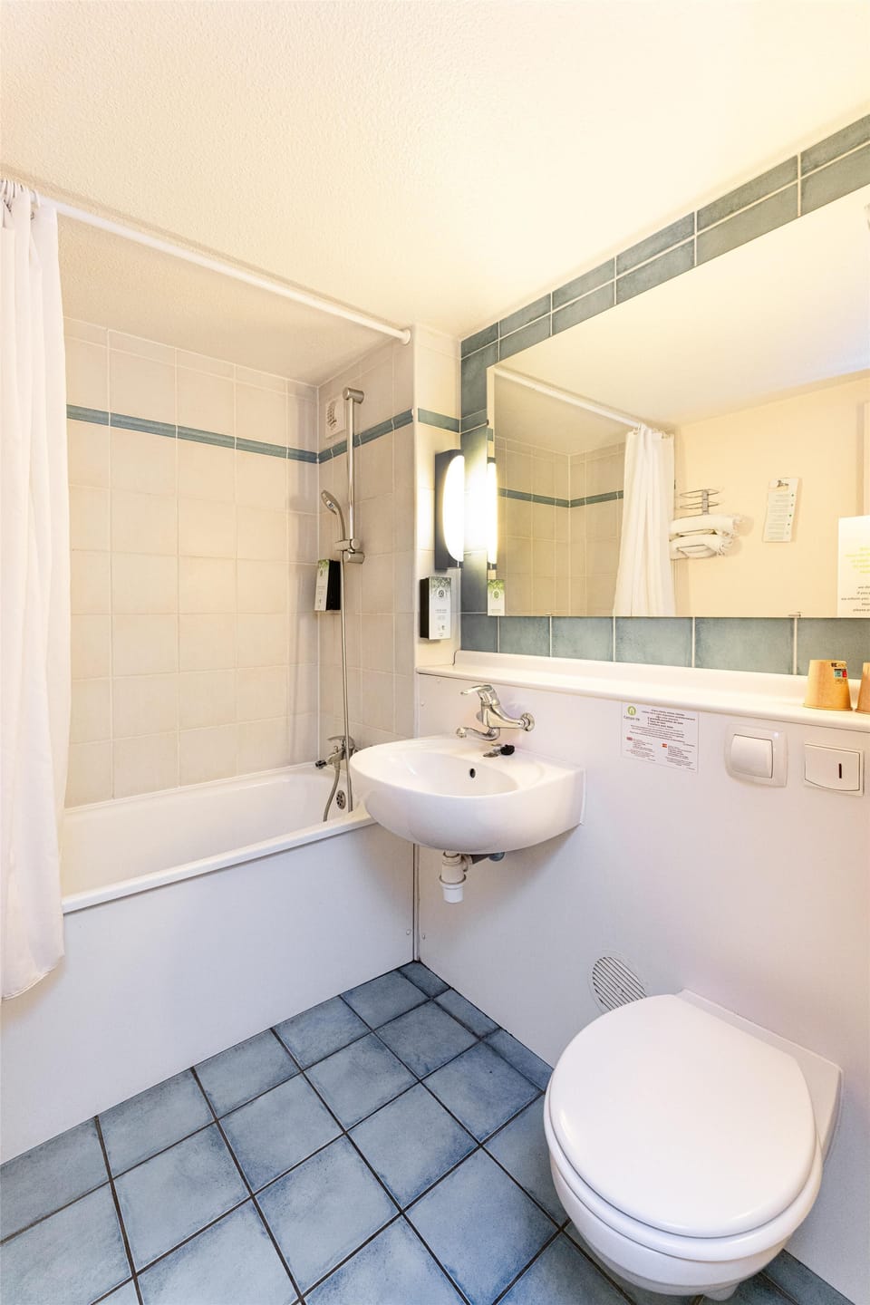 Bathtub, eco-friendly toiletries, towels