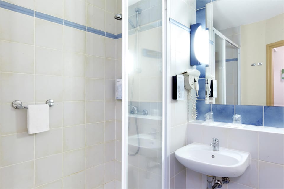 Bathtub, eco-friendly toiletries, towels