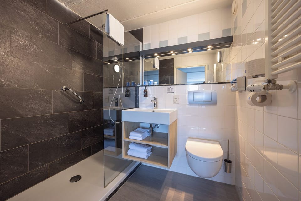 Shower, rainfall showerhead, eco-friendly toiletries, hair dryer