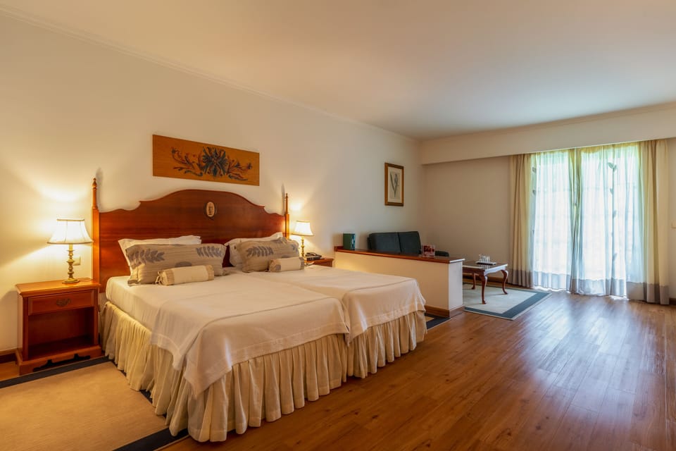 Junior Suite, Balcony, Garden View | Free minibar items, in-room safe, desk, soundproofing