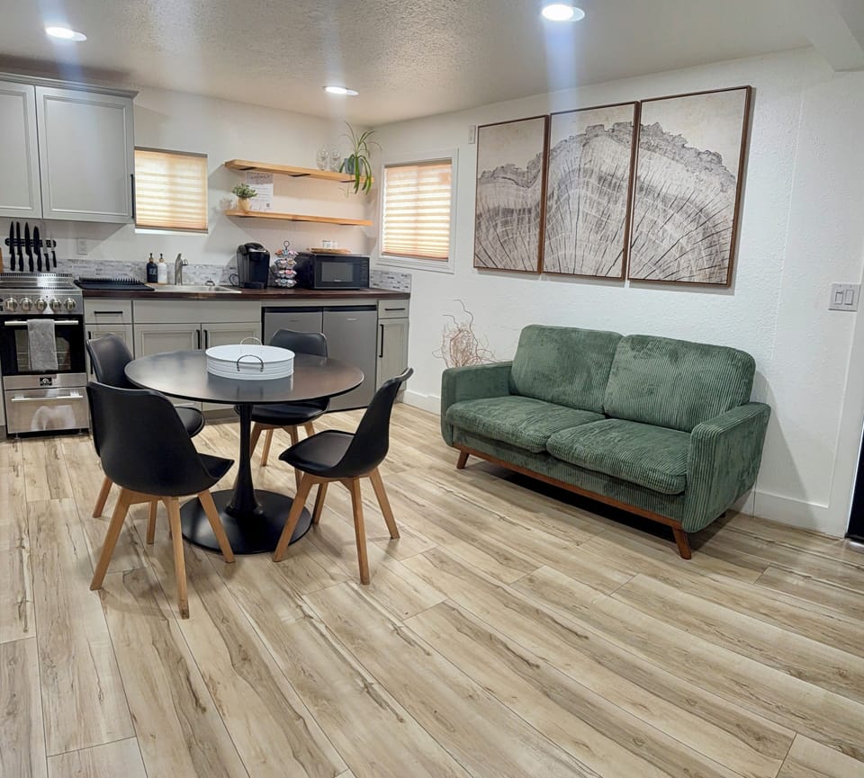 Deluxe Suite | Living area | 65-inch Smart TV with cable channels, streaming services