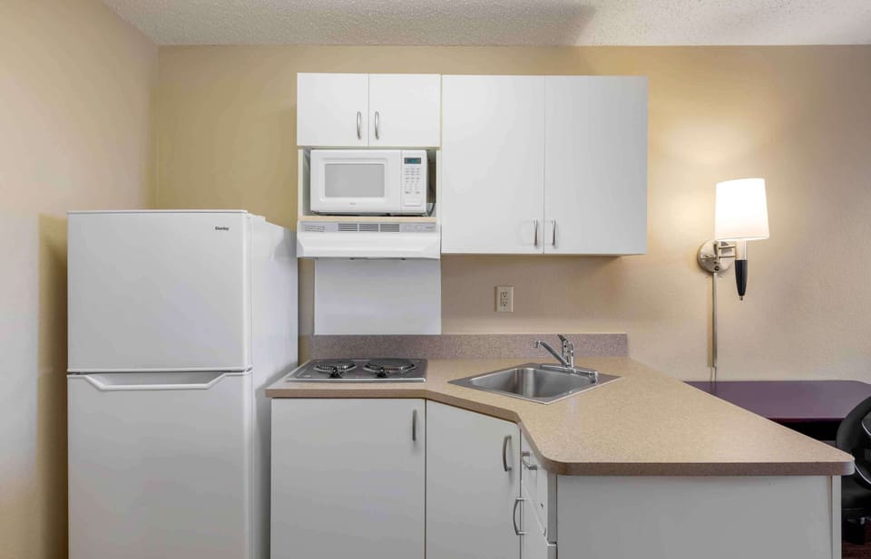Studio, 1 Queen Bed, Non Smoking | Private kitchen | Full-size fridge, microwave, stovetop, coffee/tea maker