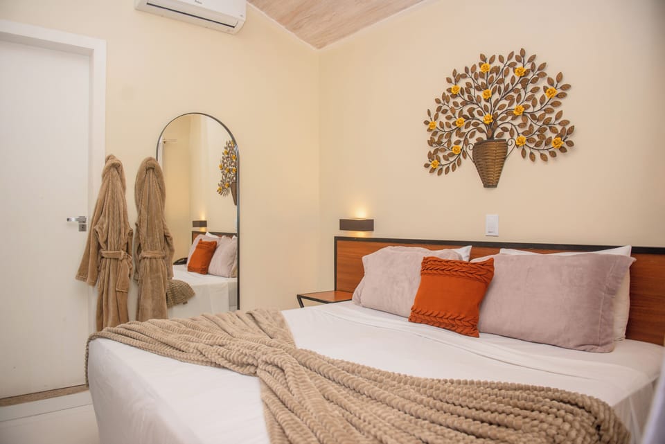 Standard Room | Minibar, in-room safe, individually decorated, blackout drapes
