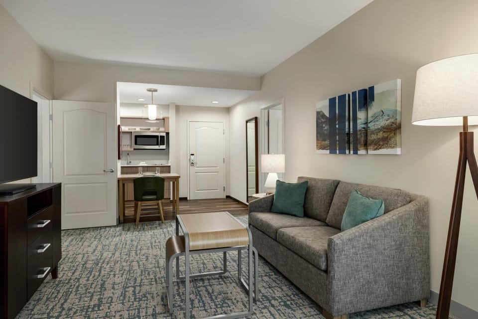 Suite, Non Smoking | Living area | 40-inch flat-screen TV with satellite channels, TV, DVD player