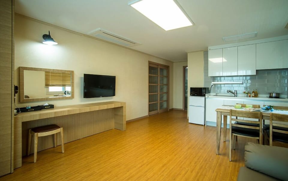 Family Room, 1 Bedroom, Kitchenette, Partial Sea View | Living area | 40-inch flat-screen TV with cable channels, TV, pay movies