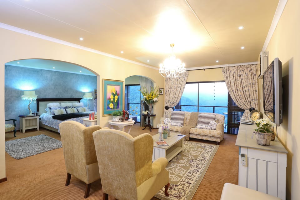 Honeymoon Suite, 1 Bedroom, Private Bathroom, Mountain View | Living area | 42-inch flat-screen TV with satellite channels, TV, DVD player