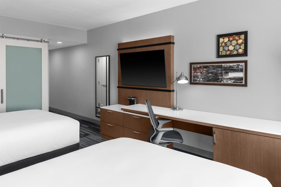 Desk, laptop workspace, blackout drapes, iron/ironing board
