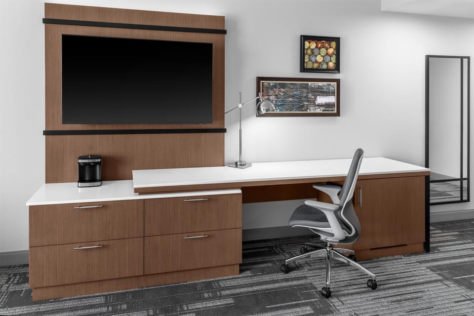 Desk, laptop workspace, blackout drapes, iron/ironing board
