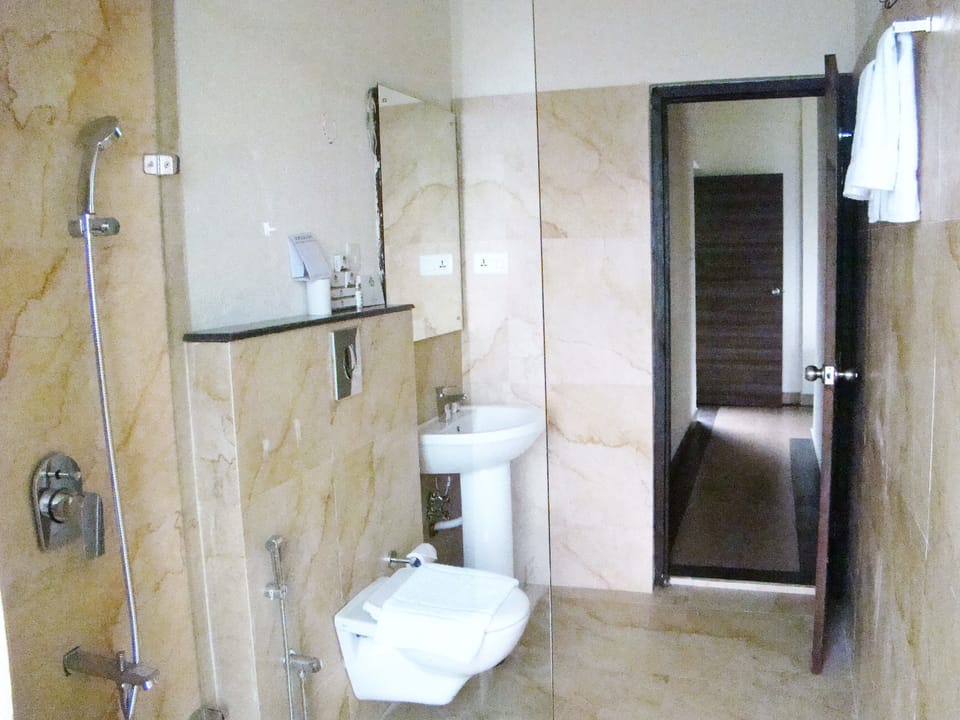 Shower, free toiletries, slippers, towels