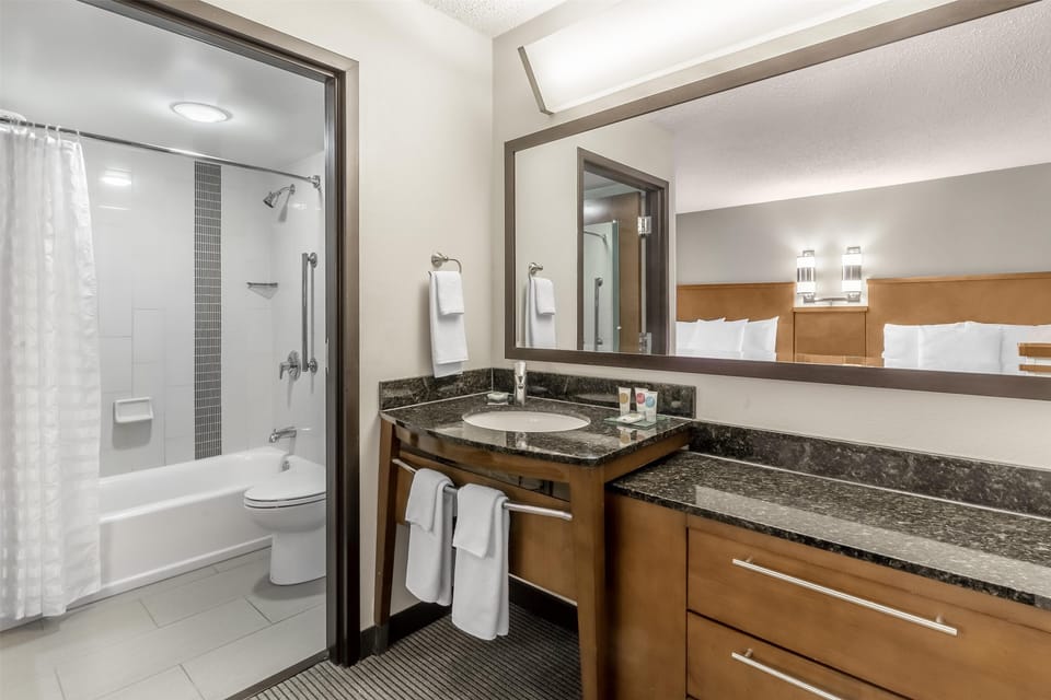 Designer toiletries, hair dryer, towels, soap