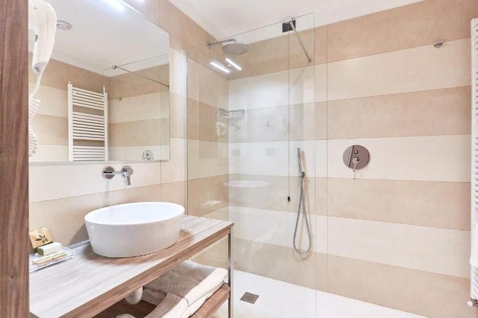 Rainfall showerhead, free toiletries, hair dryer, slippers