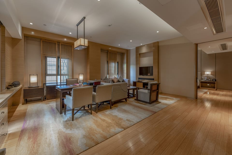 Deluxe Suite | Living area | Plasma TV, DVD player, iPod dock