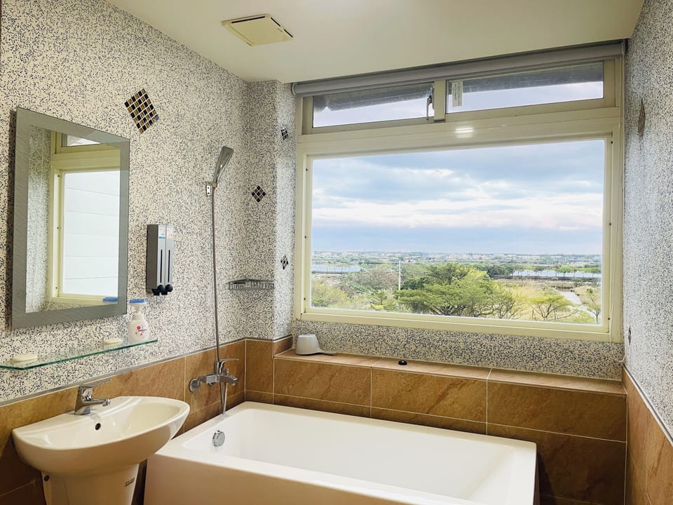 Quadruple Room, Courtyard View | Bathroom | Shower, free toiletries, hair dryer, slippers