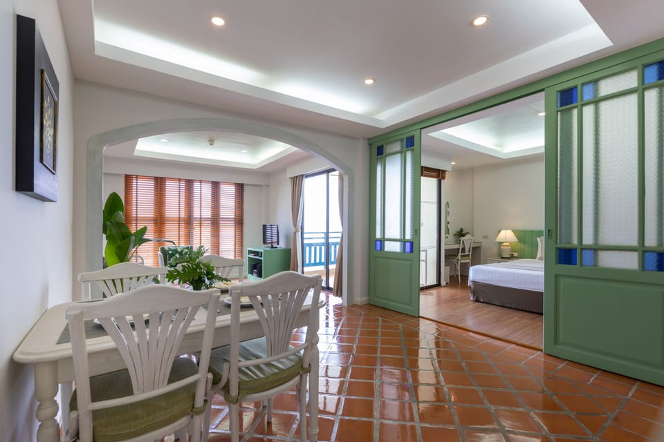 Suite, 1 Bedroom | Living area | 32-inch LCD TV with cable channels, TV, DVD player