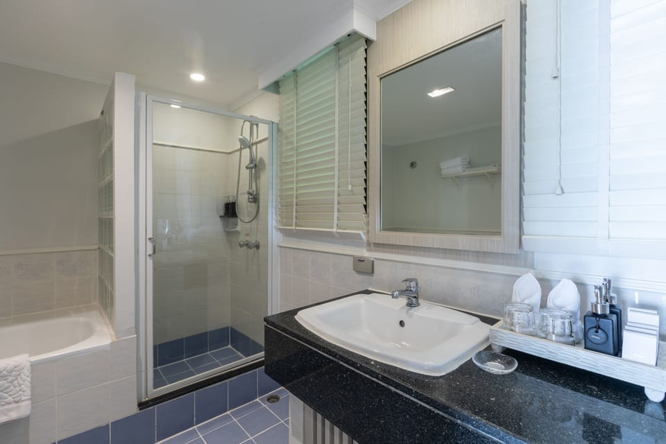 Suite, 1 Bedroom | Bathroom | Combined shower/tub, deep soaking tub, rainfall showerhead