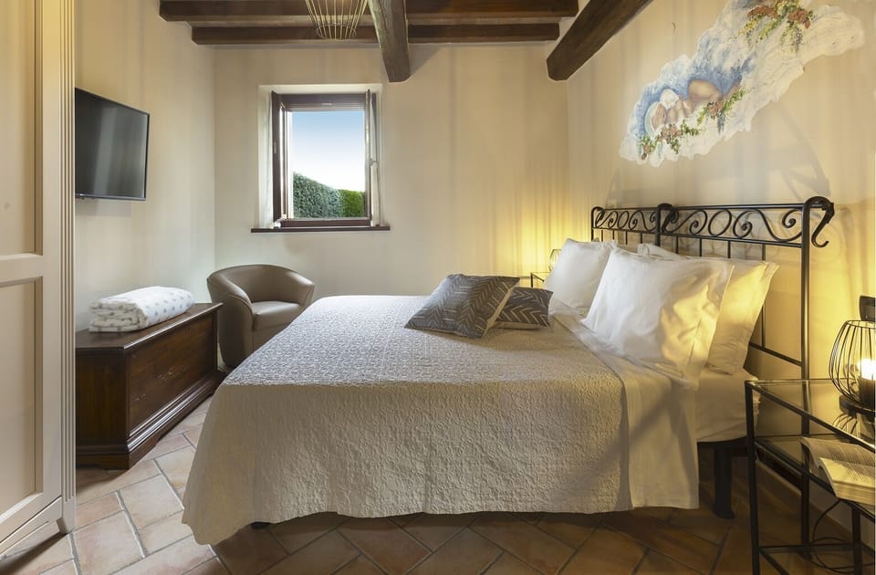Apartment, 1 Bedroom, Garden Area | Pillowtop beds, desk, blackout drapes, iron/ironing board