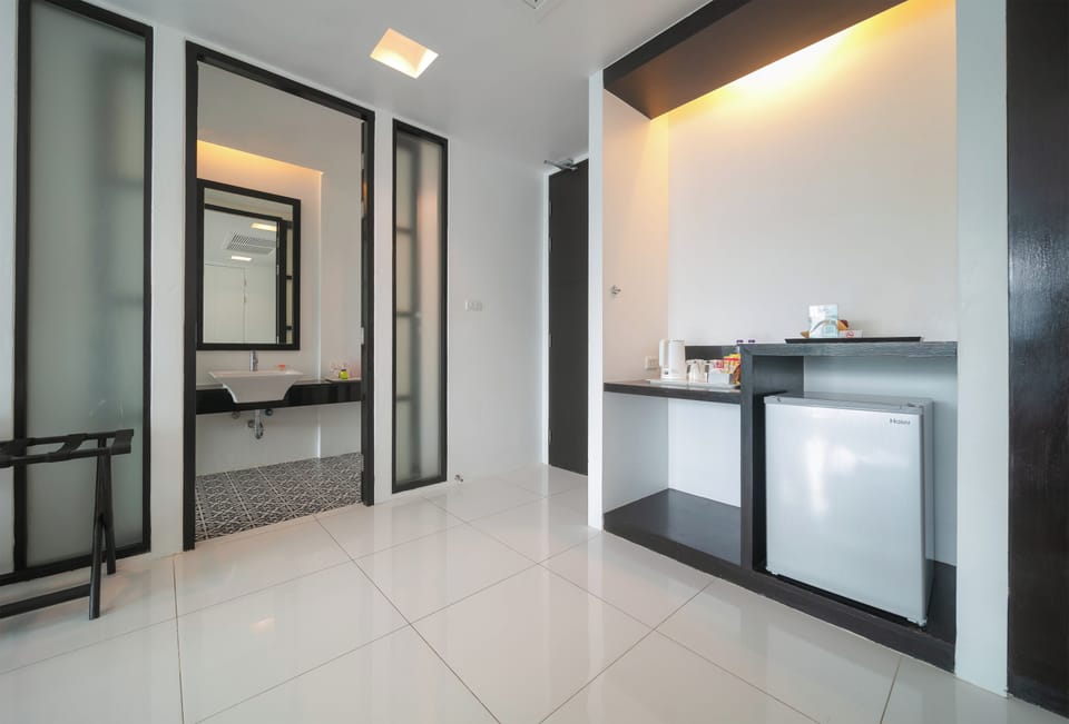 Deluxe Room, Bathtub, Pool View | Bathroom | Free toiletries, hair dryer, bathrobes, slippers
