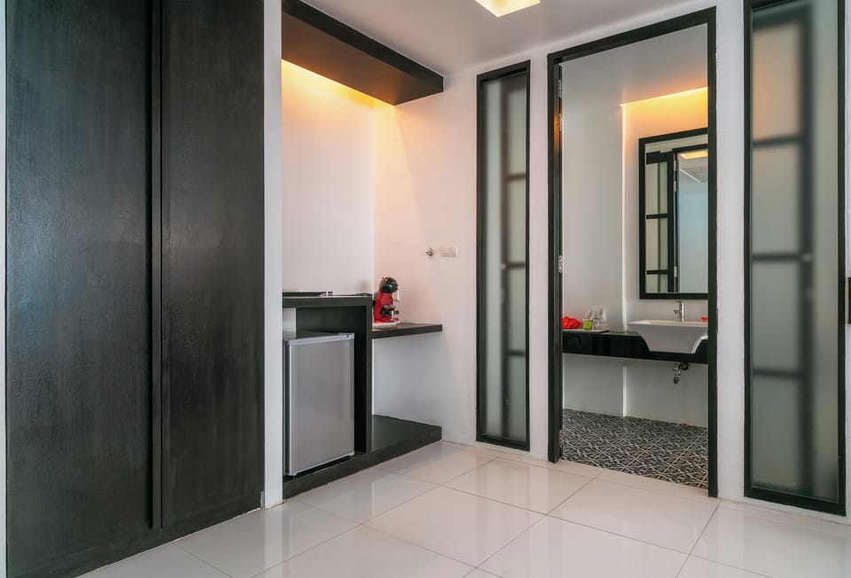 Deluxe Room, Pool Access | Minibar, in-room safe, desk, blackout drapes