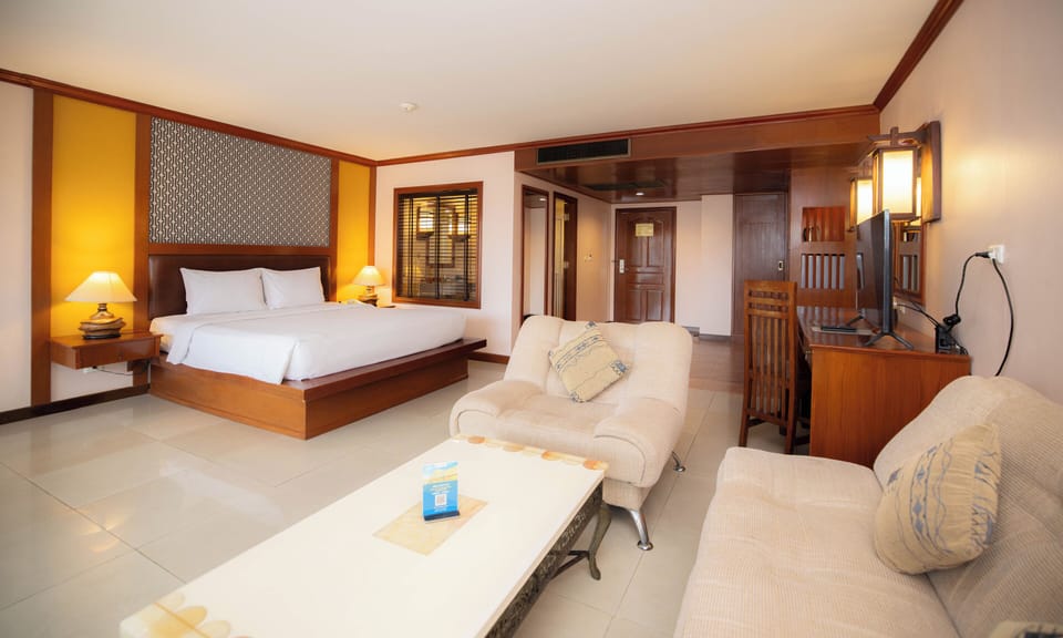Executive Pool View King Room with Balcony | Minibar, in-room safe, desk, blackout drapes