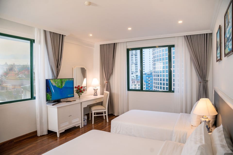 Deluxe Double or Twin Room | Minibar, in-room safe, desk, laptop workspace