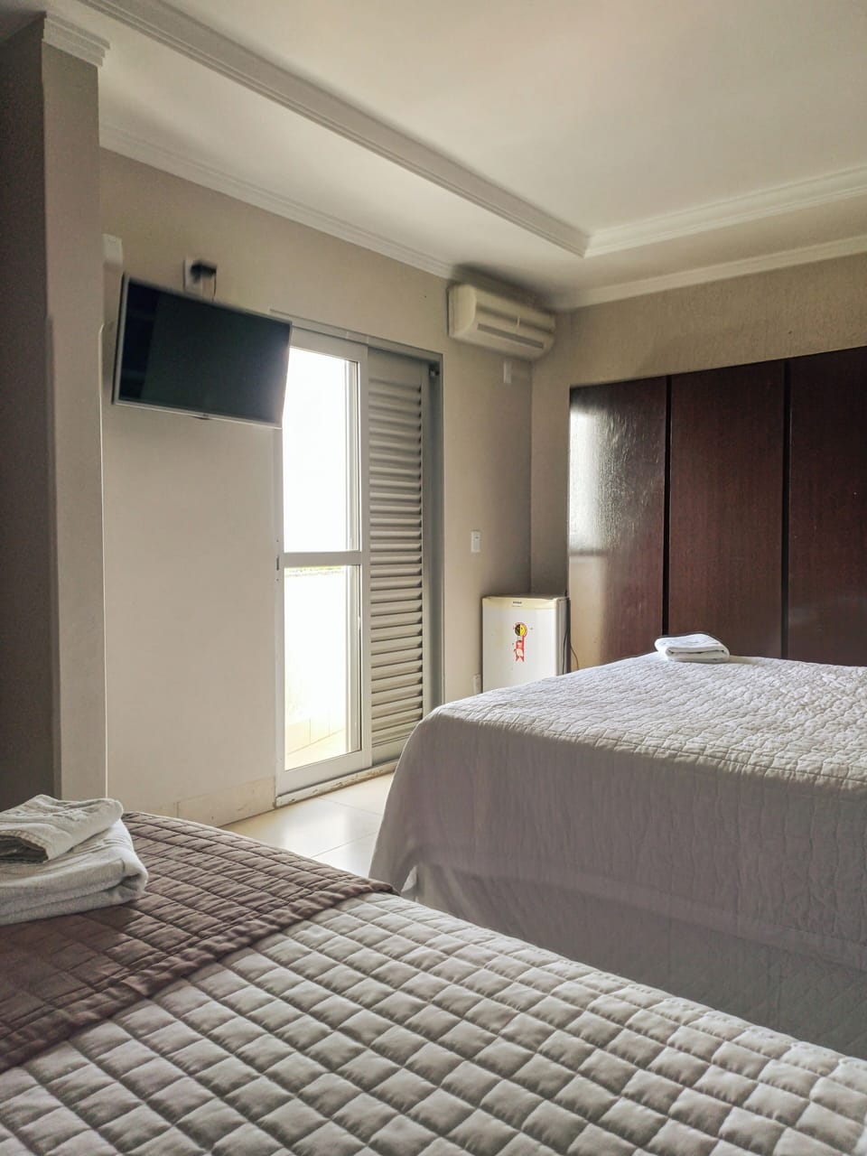 Triple Room, Multiple Beds, City View | Minibar, in-room safe, desk, free WiFi