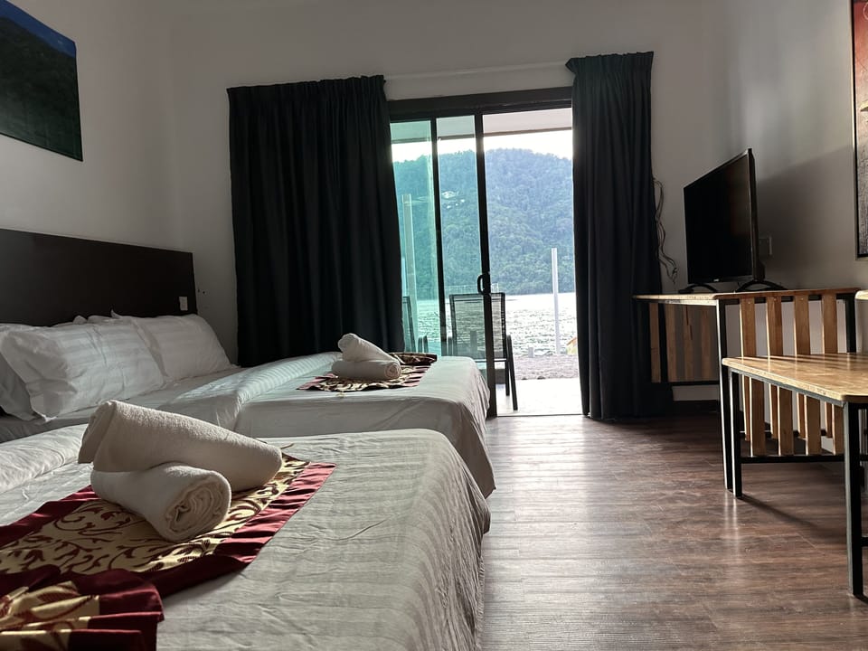 Seafront Family Room | In-room safe, desk, iron/ironing board, bed sheets