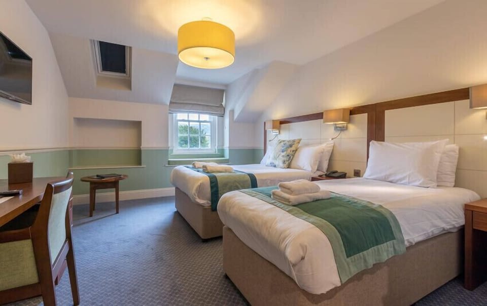 Superior Room | Desk, iron/ironing board, bed sheets