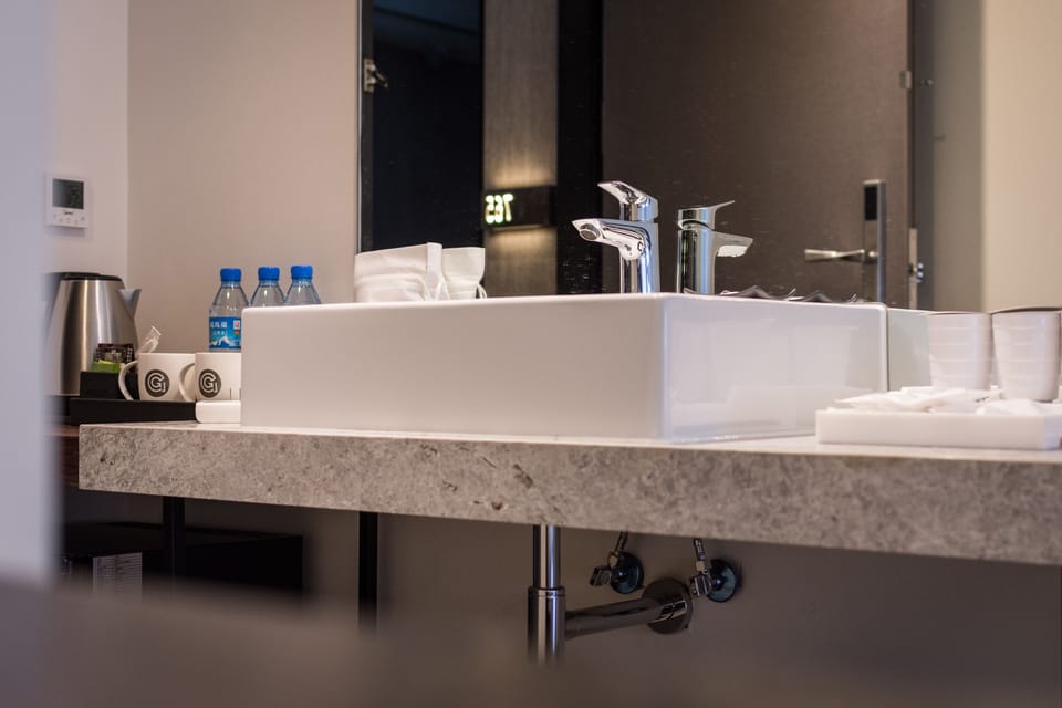 Business Triple Room | Minibar, in-room safe, individually decorated, desk