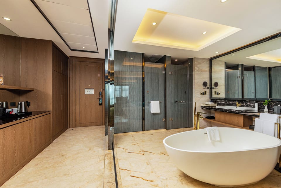 Premier Suite | Bathroom | Designer toiletries, hair dryer, bathrobes, slippers