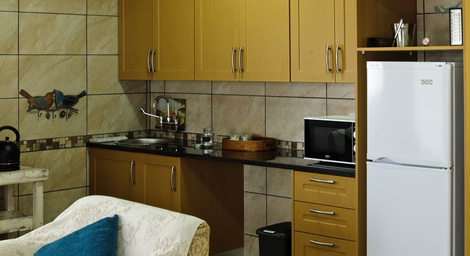 Luxury Double Room, 1 King Bed, Non Smoking, Garden View | Private kitchenette | Full-size fridge, microwave, coffee/tea maker, electric kettle