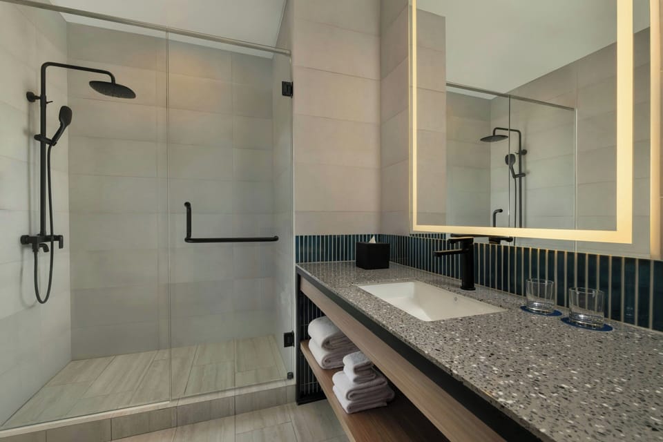 Shower, free toiletries, hair dryer, slippers