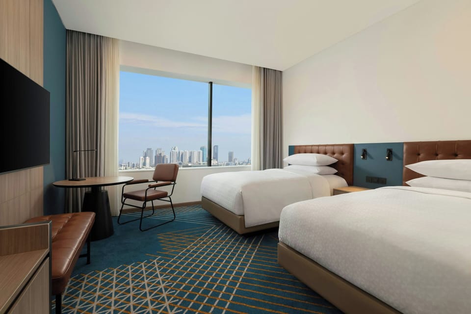 Twin Room, 2 Twin Beds | Minibar, in-room safe, individually decorated, individually furnished