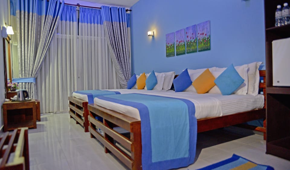 Standard Triple Room | Minibar, in-room safe, desk, soundproofing
