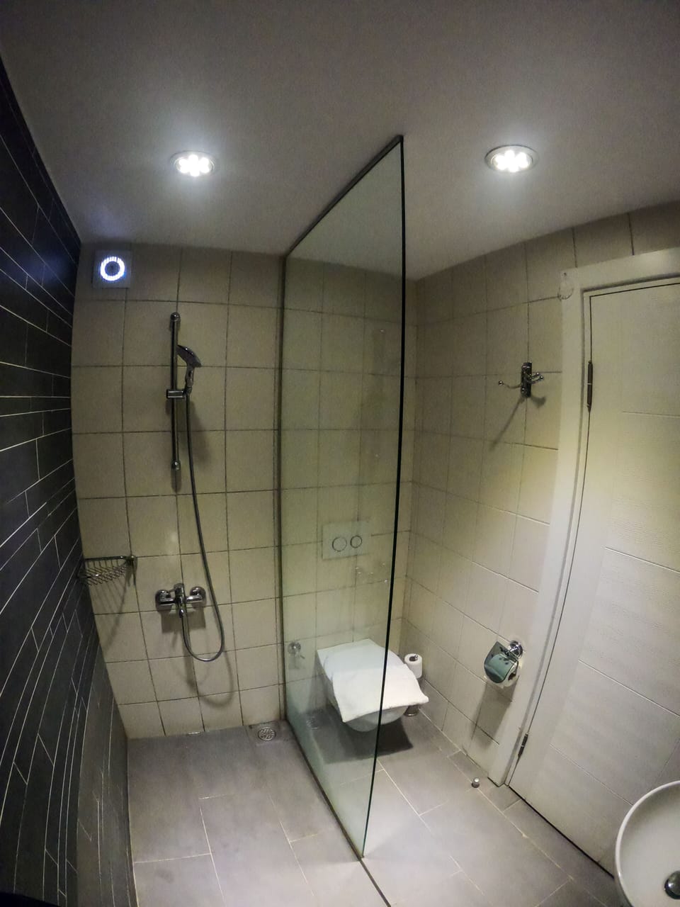 Shower, hair dryer, slippers, towels