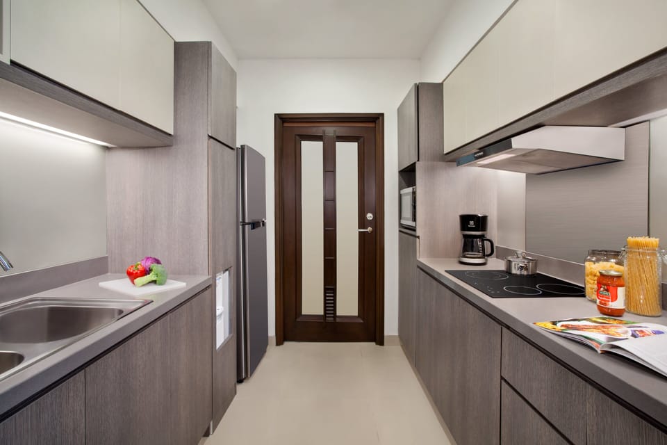  2 Bedroom Premier | Private kitchen | Full-size fridge, electric kettle, cookware/dishes/utensils