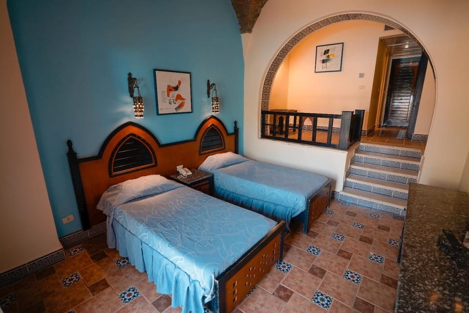 Standard Double Room | Minibar, in-room safe, iron/ironing board, free cribs/infant beds