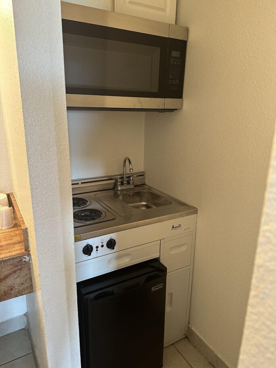 Fridge, microwave, stovetop, cookware/dishes/utensils