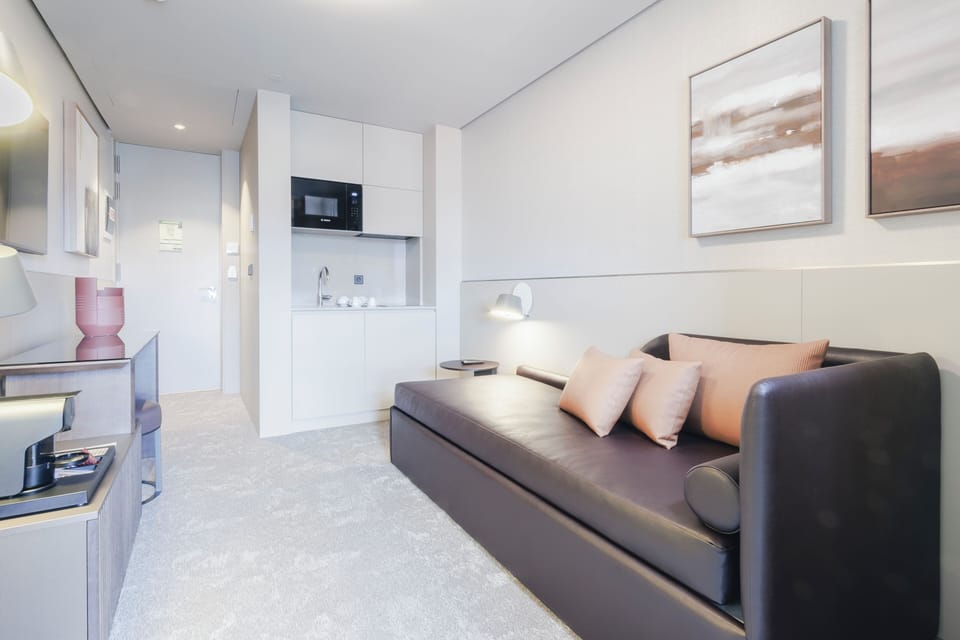 Suite, Kitchenette (Sky) | Living area | Flat-screen TV