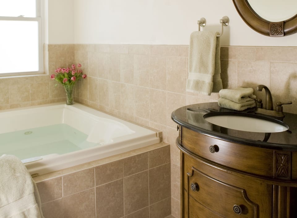 Suite, 1 Queen Bed (Jacuzzi  and Fireplace) | Bathroom | Free toiletries, hair dryer, towels