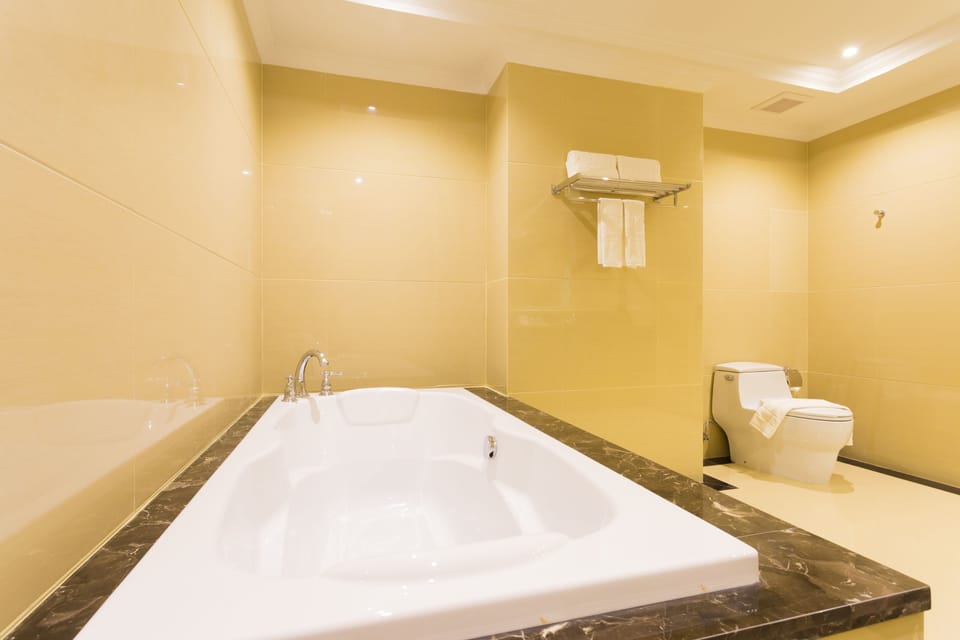 Shower, deep soaking tub, hydromassage showerhead, designer toiletries
