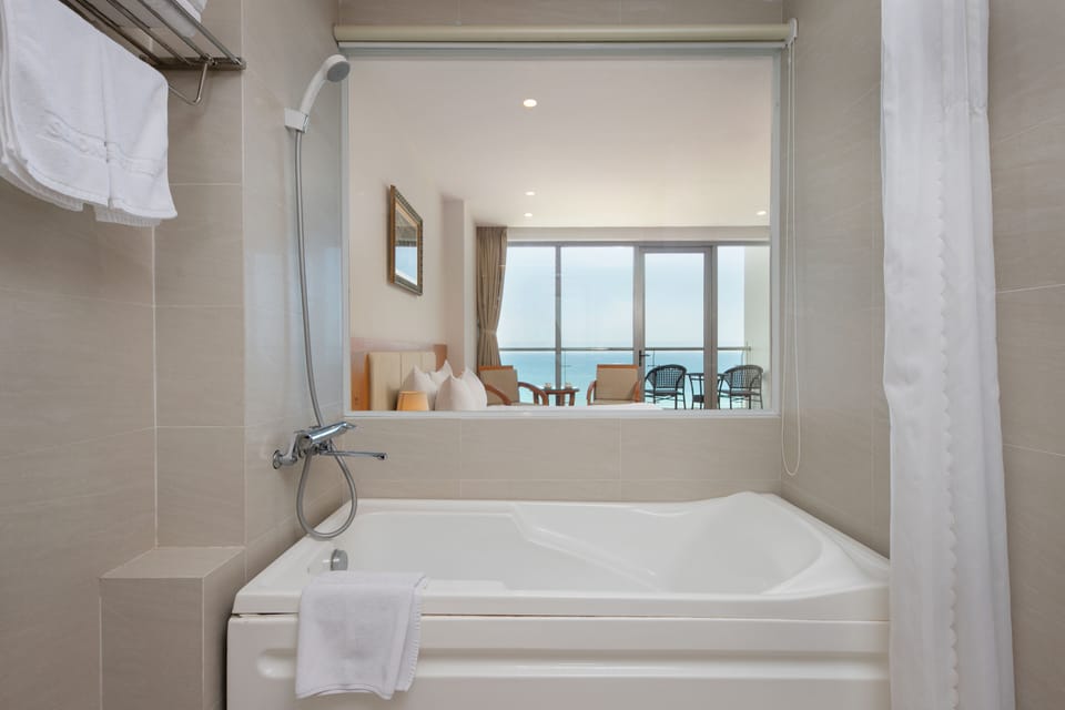 Suite, Seafront | Bathroom | Free toiletries, hair dryer, slippers, towels