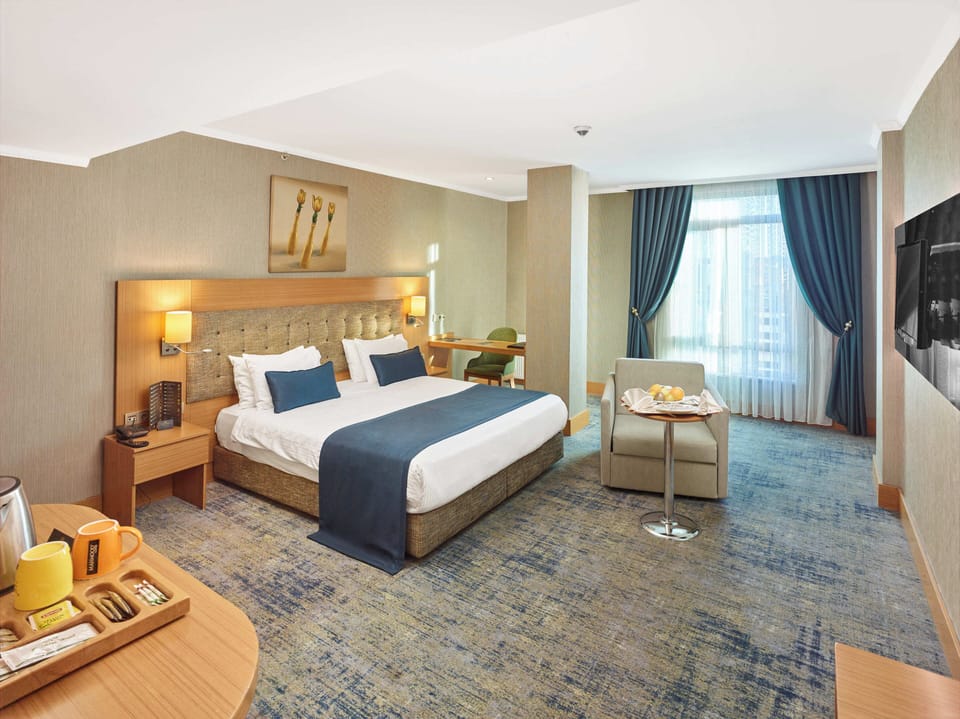 Standard Double or Twin Room | Minibar, in-room safe, desk, rollaway beds