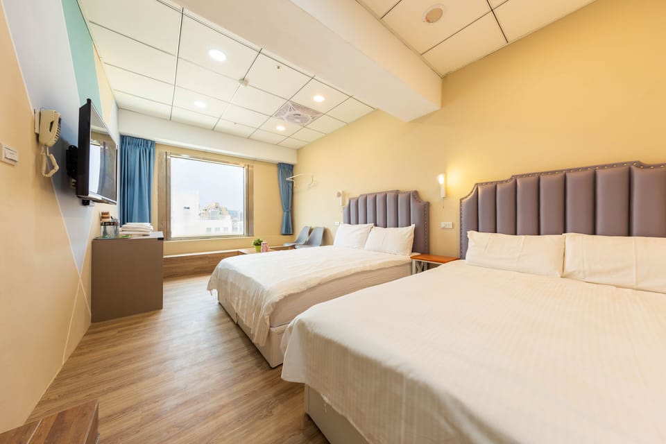 Deluxe Quadruple Room, Bathtub, City View | Egyptian cotton sheets, premium bedding, desk, blackout drapes