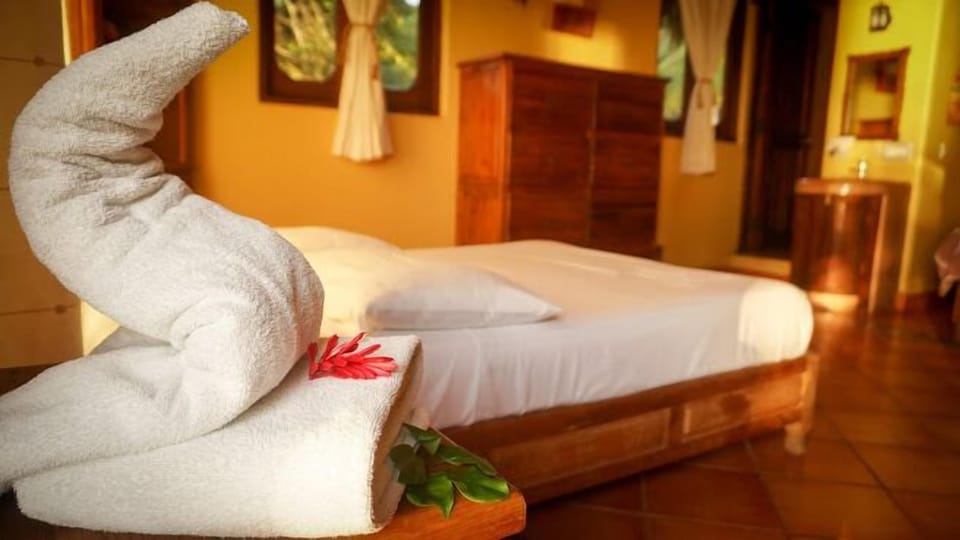 Double Room, Ocean View | Blackout drapes, iron/ironing board, free WiFi, bed sheets