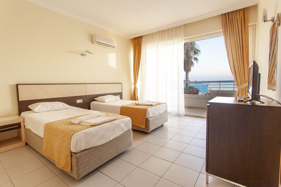 Standard Double or Twin Room, Sea View | Minibar, in-room safe, desk, soundproofing