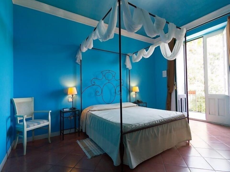 Superior Triple Room, Pool View | Minibar, in-room safe, desk, soundproofing