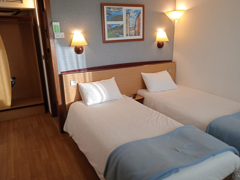 Premium bedding, desk, blackout drapes, iron/ironing board