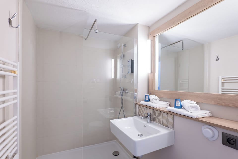 Shower, eco-friendly toiletries, hair dryer, towels