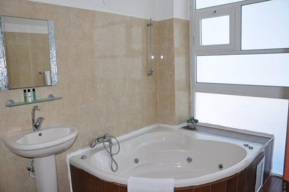 Shower, free toiletries, hair dryer, slippers